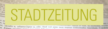 Grüner Text "Stadtzeitung" auf Zeitung